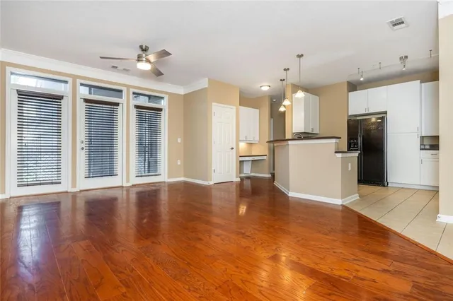 a view of a kitchen with a refrigerator a microwave and a refrigerator
