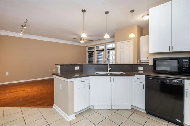 a kitchen with a sink and cabinets