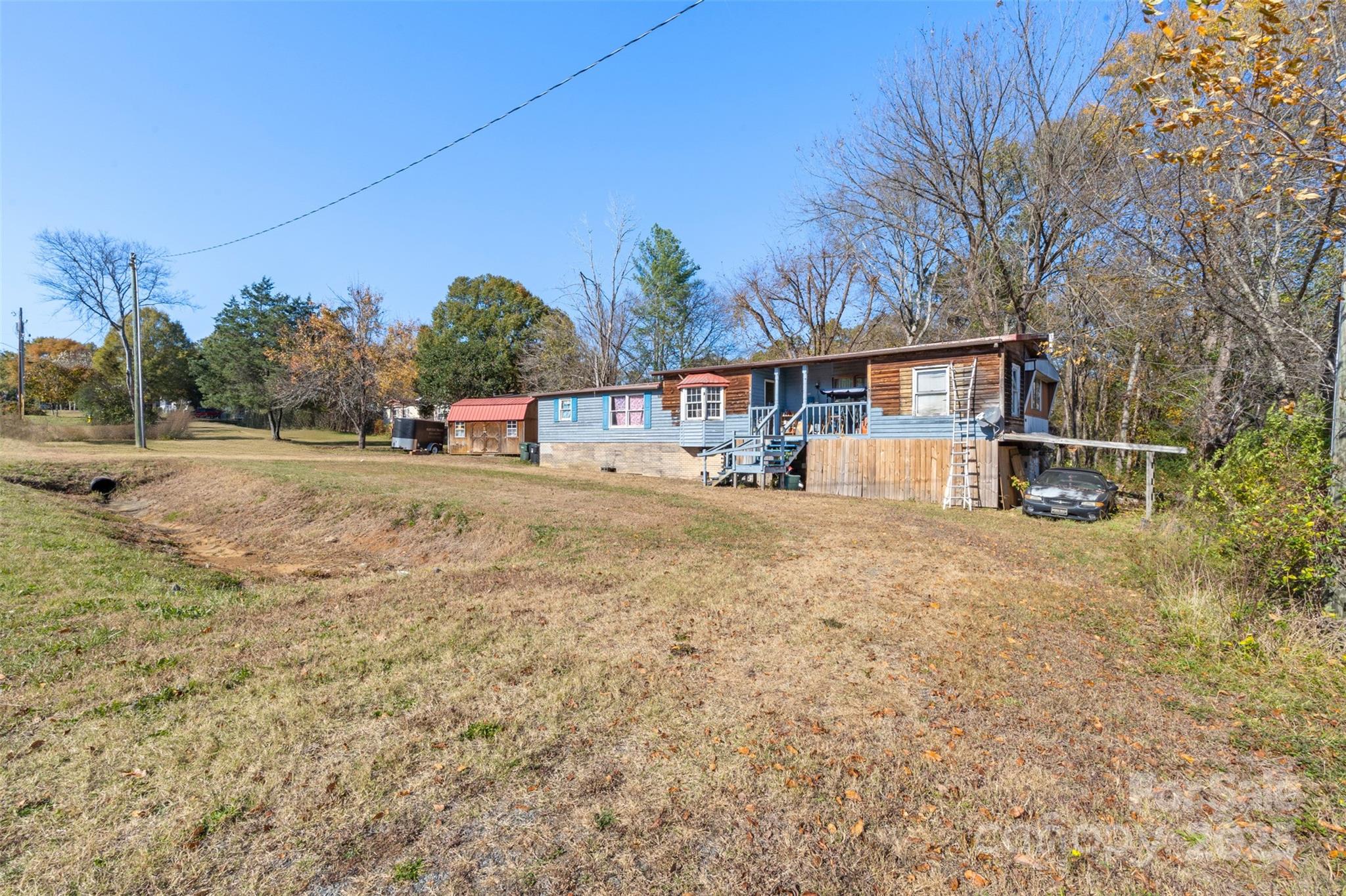 3913 Stough Road Concord, NC 28027 - Photo 13 of 20 front view of a house with a dirt yard