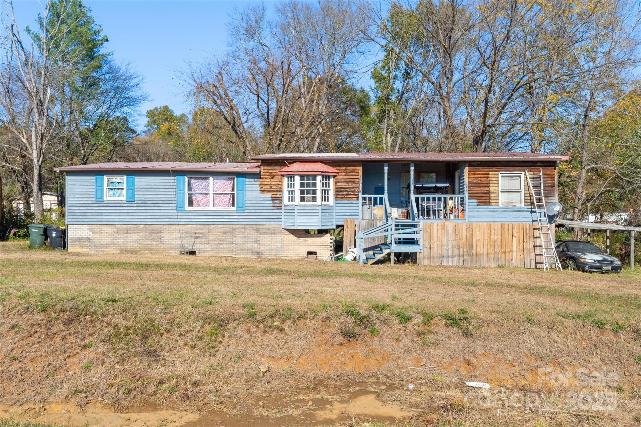 3913 Stough Road Concord, NC 28027 - Photo 15 of 20 a view of a house with a patio