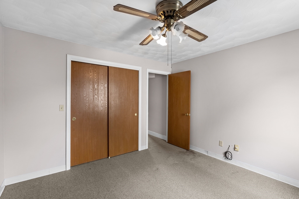 70 North Court Street, Unit F Fall River, MA 02720 - Photo 16 of 20 an empty room with a chandelier fan