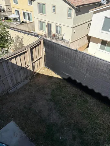 a view of a house with a wooden deck