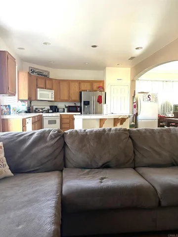 a living room with furniture and a large window