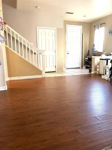 a view of a living room with hardwood floor