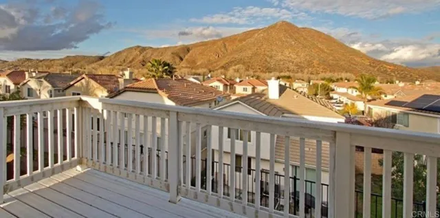 a view of a brick house with a large window