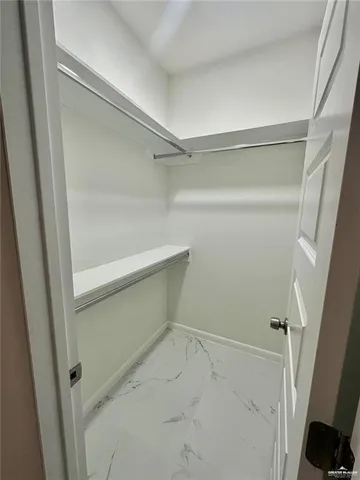 a view of an empty walk in closet