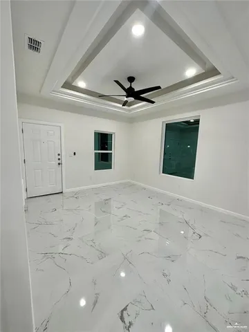 a view of a livingroom with a ceiling fan