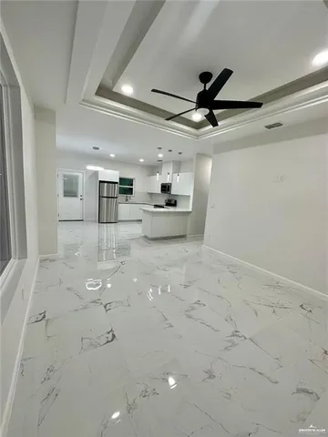 a view of a kitchen with a sink and cabinets