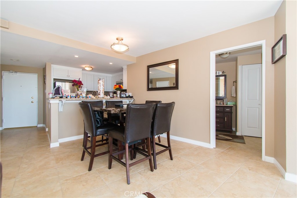 700 East Ocean Boulevard, Unit 706 Long Beach, CA 90802 - Photo 11 of 31 a view of a dining room with furniture