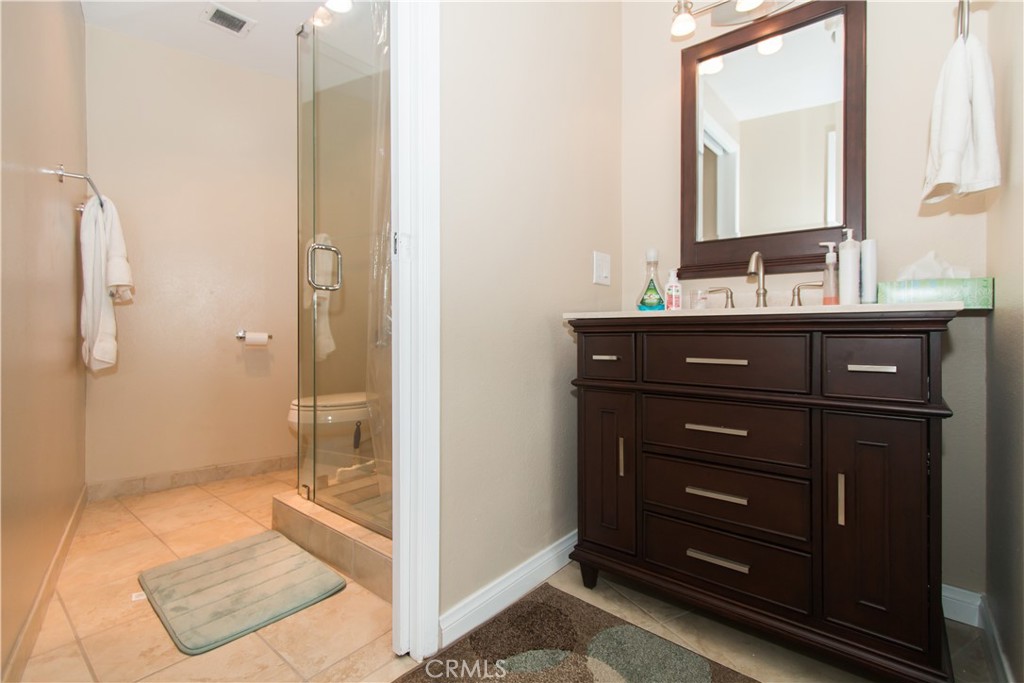 700 East Ocean Boulevard, Unit 706 Long Beach, CA 90802 - Photo 25 of 31 a bathroom with a sink a toilet and shower