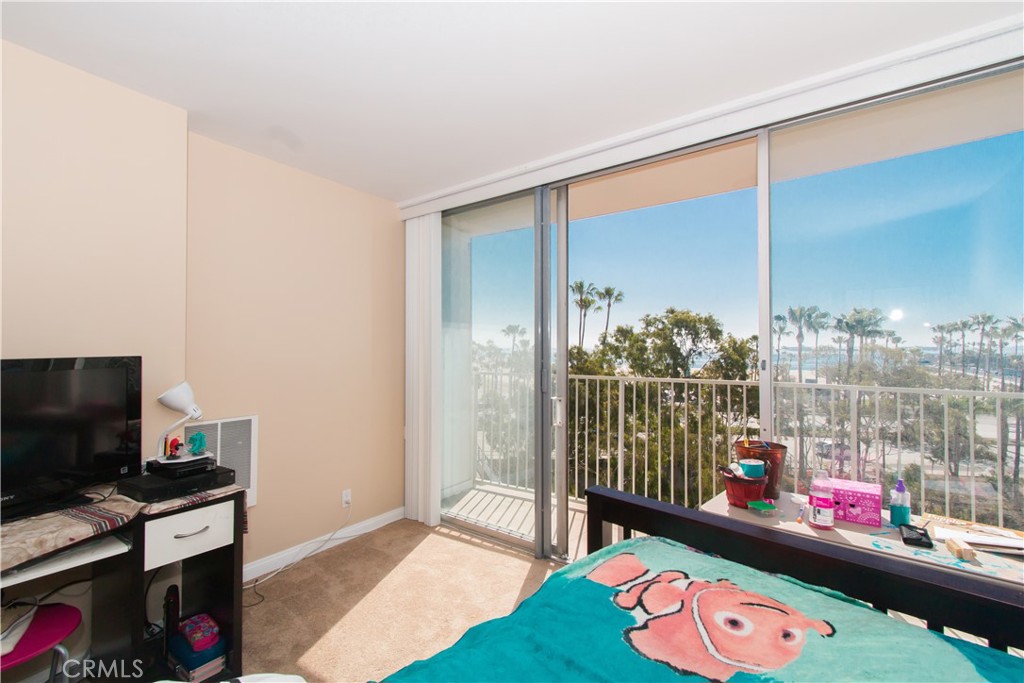 700 East Ocean Boulevard, Unit 706 Long Beach, CA 90802 - Photo 26 of 31 a living room with furniture and a flat screen tv