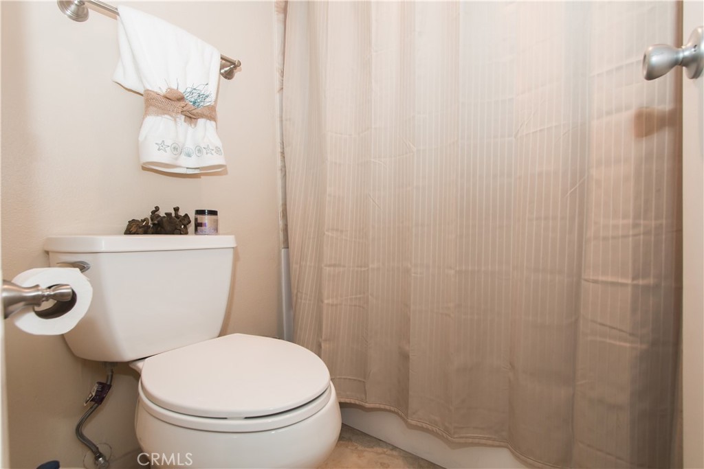 700 East Ocean Boulevard, Unit 706 Long Beach, CA 90802 - Photo 27 of 31 a white toilet sitting next to a bathroom sink