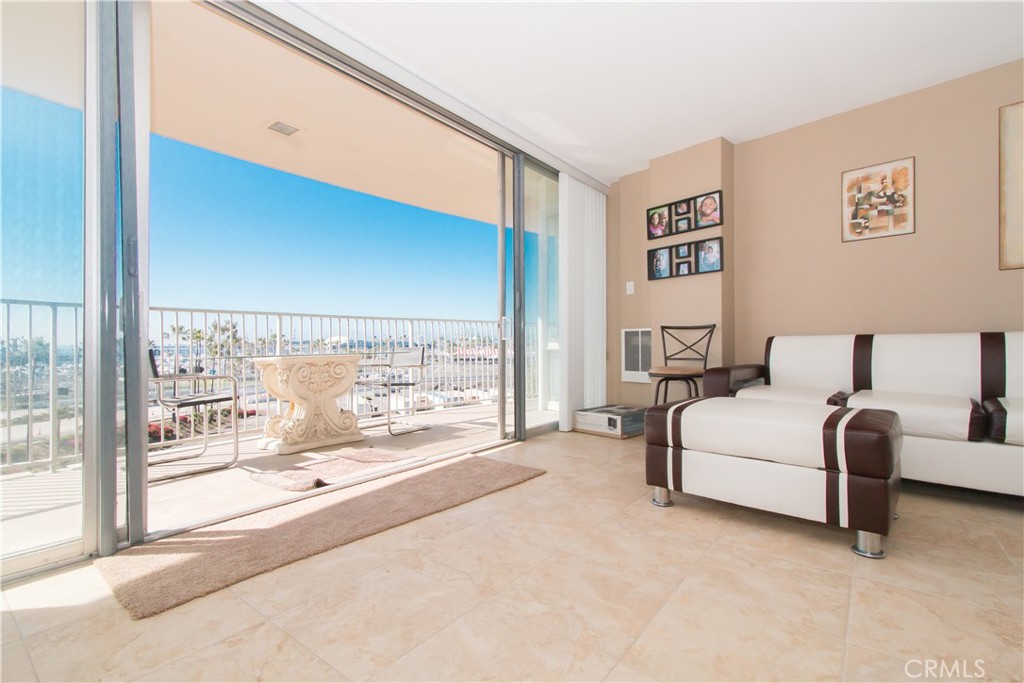 700 East Ocean Boulevard, Unit 706 Long Beach, CA 90802 - Photo 4 of 31 a living room with furniture and large windows