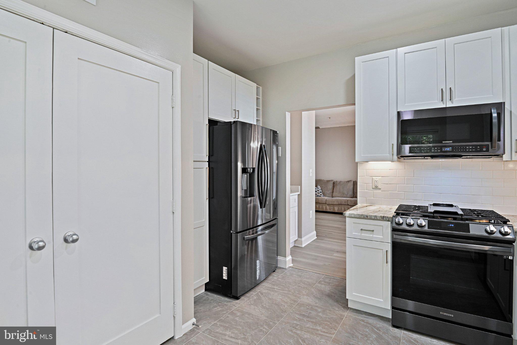 1519 North Point Drive, Unit 202 Reston, VA 20194 - Photo 18 of 49 Modern kitchen with sleek appliances.