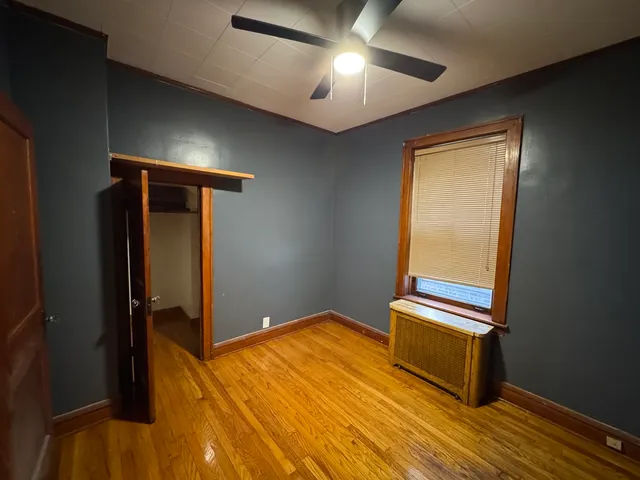 a view of room with stairs and wooden floor