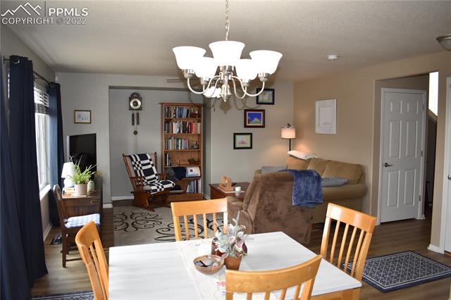 7325 Pearly Health Road Colorado Springs, CO 80908 - Photo 3 of 20 Dining Room to Family Room