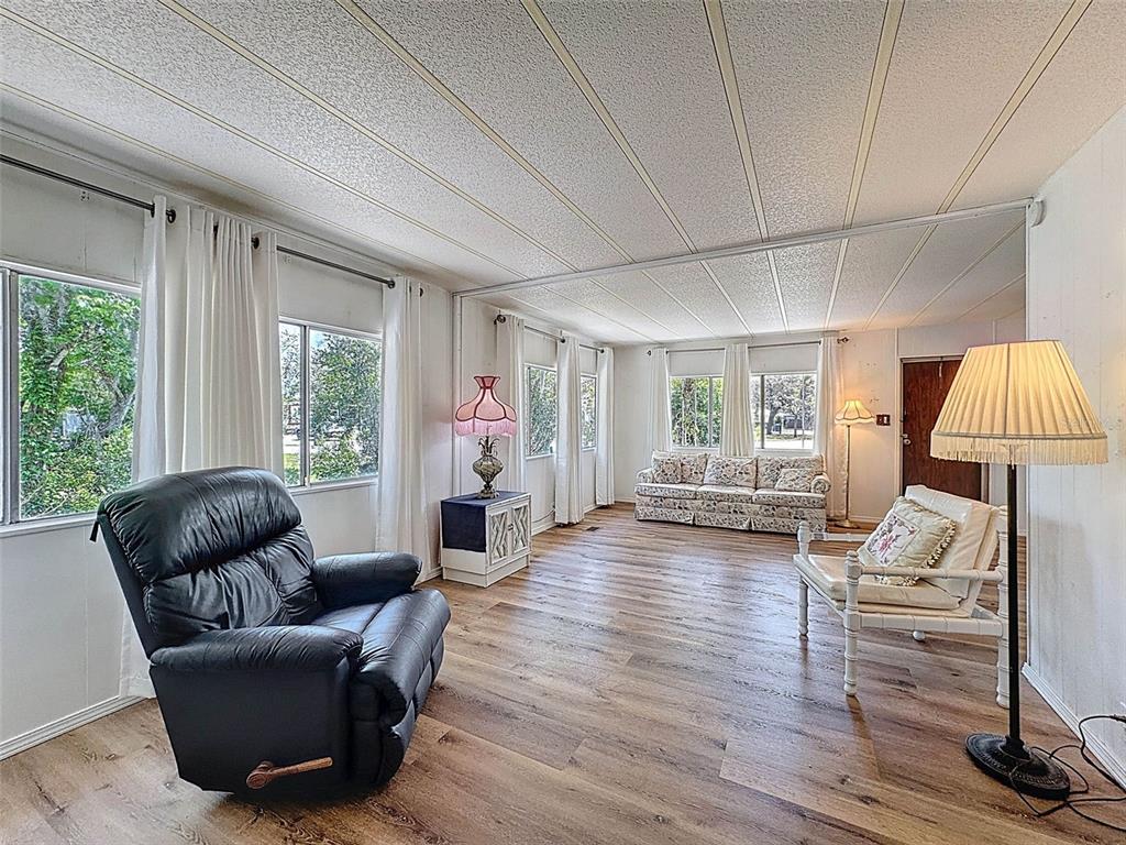 3249 Susan Drive Spring Hill, FL 34606 - Photo 12 of 60 a living room with furniture and a wooden floor