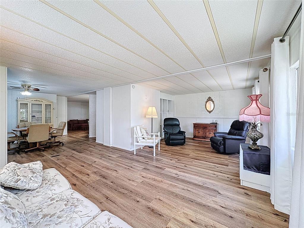 3249 Susan Drive Spring Hill, FL 34606 - Photo 14 of 60 a living room with furniture and a fireplace