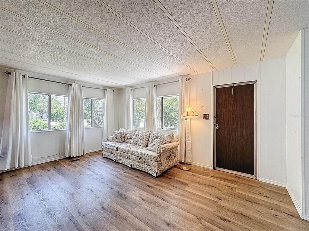 3249 Susan Drive Spring Hill, FL 34606 - Photo 15 of 60 a spacious bedroom with a bed and a window