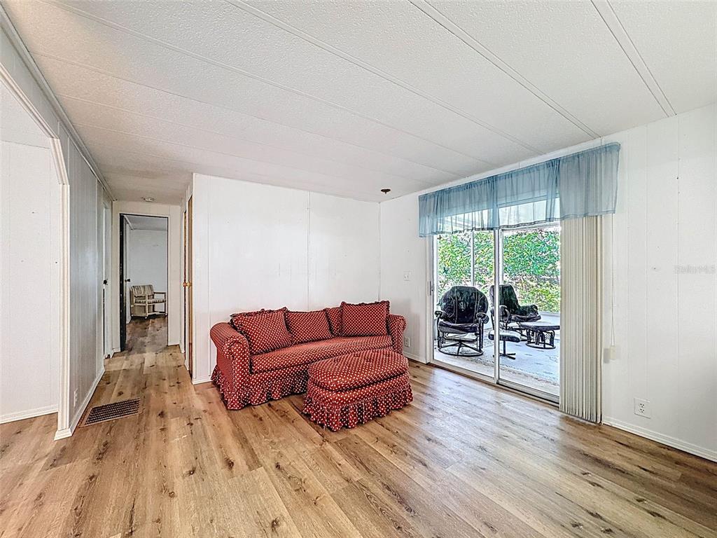 3249 Susan Drive Spring Hill, FL 34606 - Photo 29 of 60 a living room with furniture and wooden floor