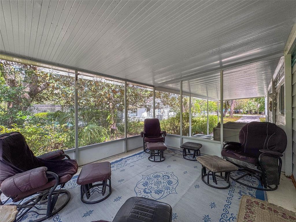 3249 Susan Drive Spring Hill, FL 34606 - Photo 32 of 60 a living room with furniture and large windows