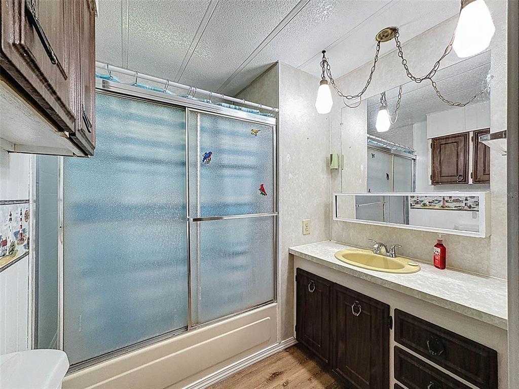3249 Susan Drive Spring Hill, FL 34606 - Photo 44 of 60 a bathroom with a shower sink and mirror