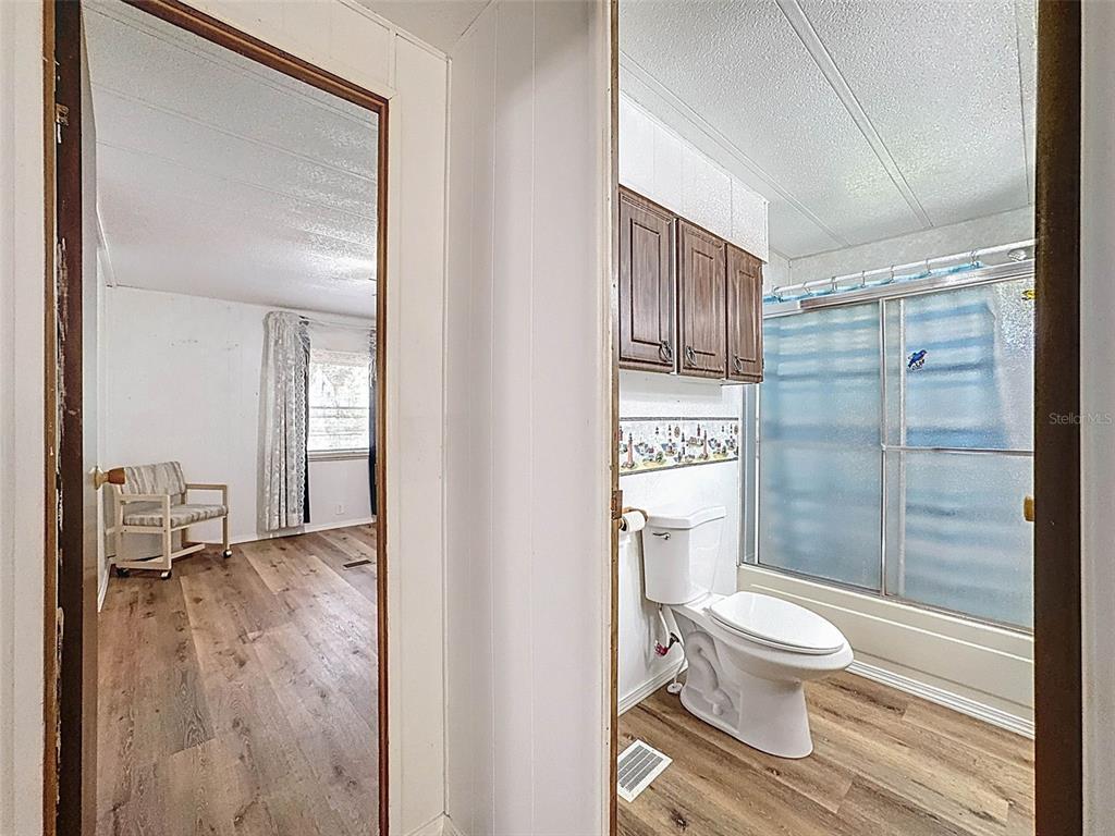 3249 Susan Drive Spring Hill, FL 34606 - Photo 46 of 60 a bathroom with a toilet and a shower