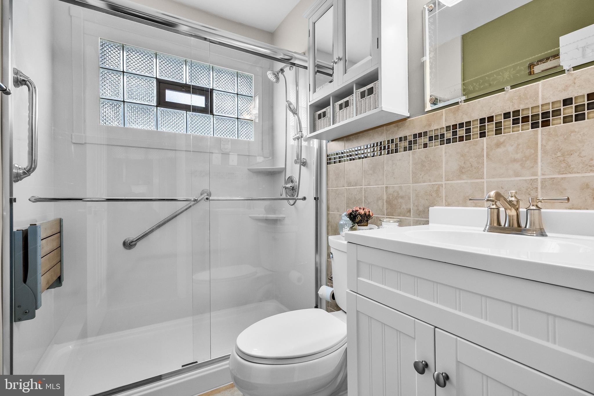 419 Delview Lane Delanco, NJ 08075 - Photo 12 of 21 a bathroom with a sink a toilet and shower