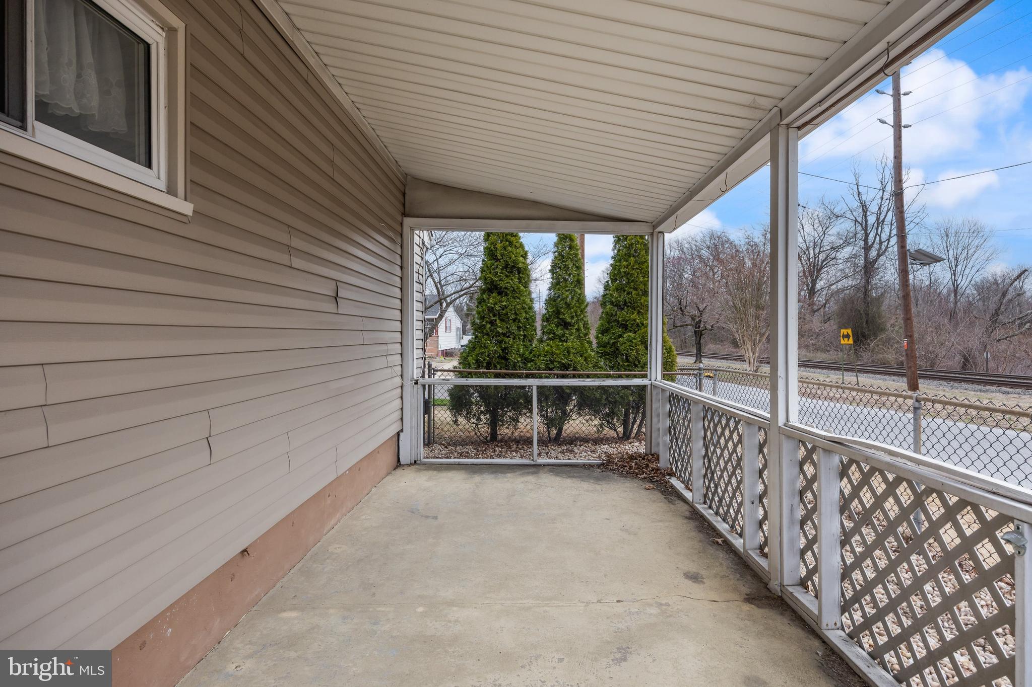 419 Delview Lane Delanco, NJ 08075 - Photo 17 of 21 a view of a porch with wooden floor and iron stairs