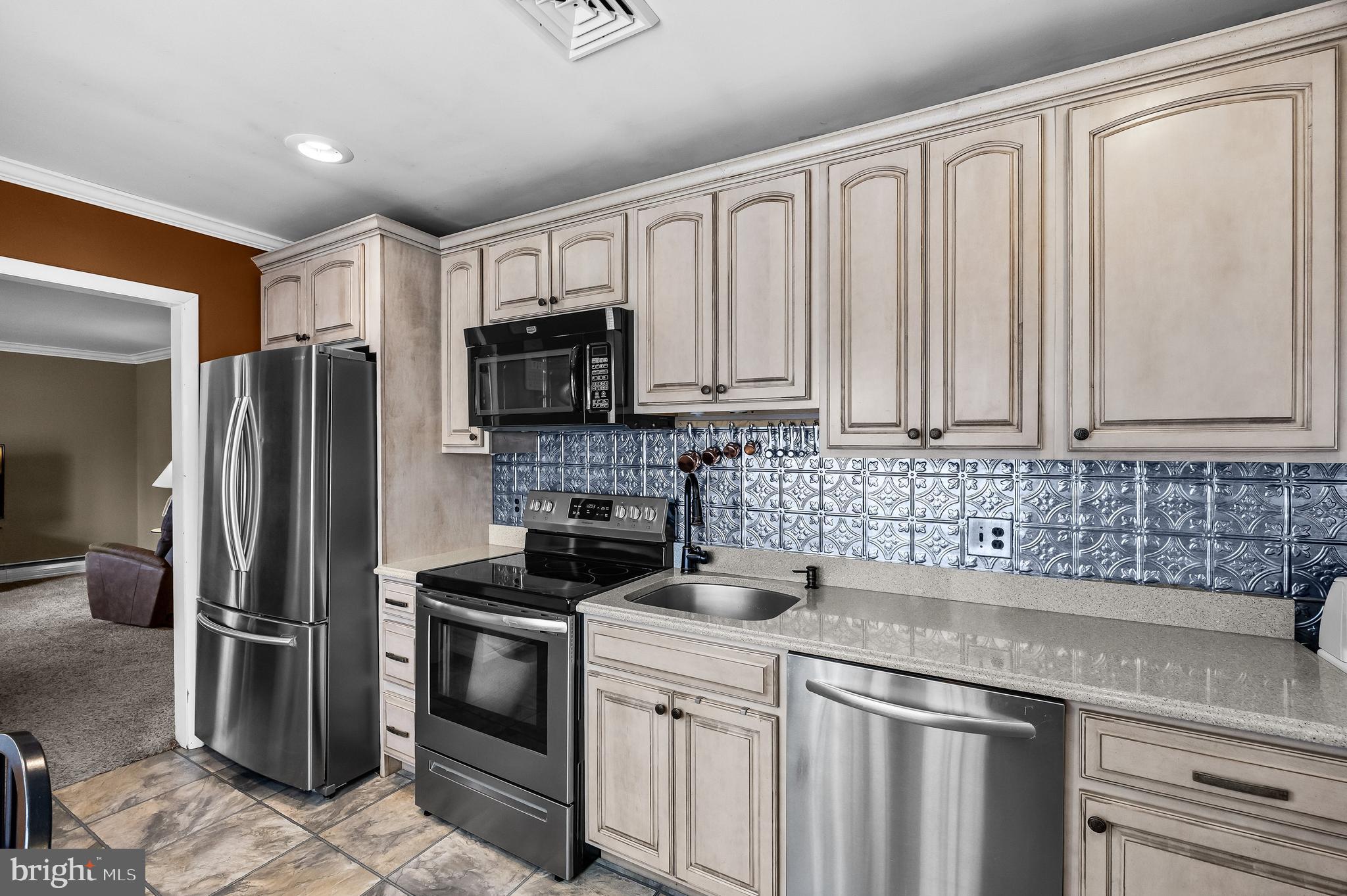 419 Delview Lane Delanco, NJ 08075 - Photo 7 of 21 a kitchen with stainless steel appliances granite countertop a refrigerator sink and stove