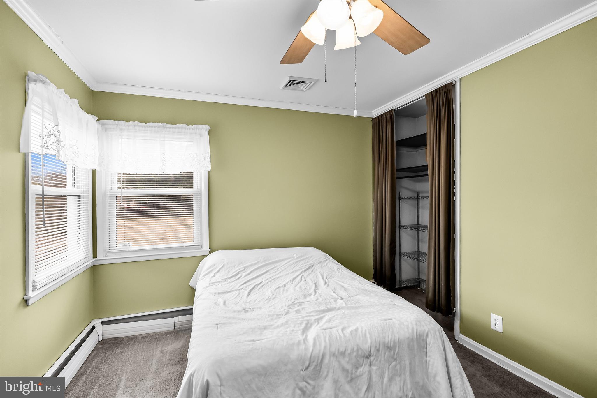 419 Delview Lane Delanco, NJ 08075 - Photo 10 of 21 a bedroom with a bed and a chandelier