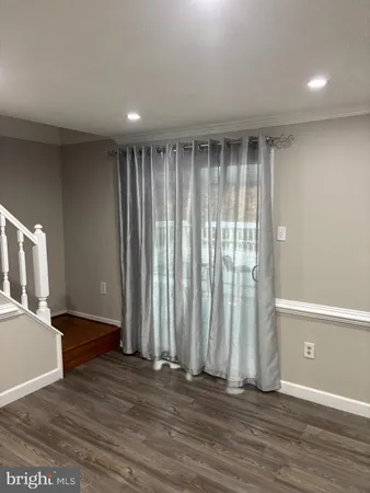 a view of entryway with wooden floor