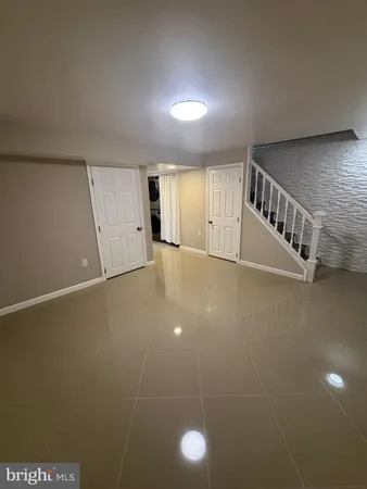 a view of an empty room with stairs