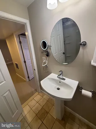 a bathroom with a sink and mirror