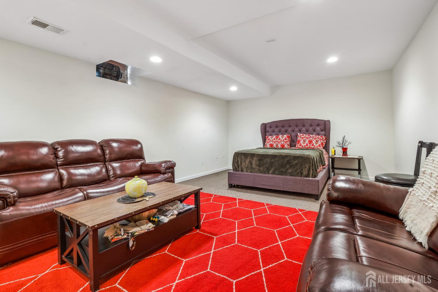 489 Plainfield Road Edison, NJ 08820 - Photo 32 of 39 a living room with furniture and a rug