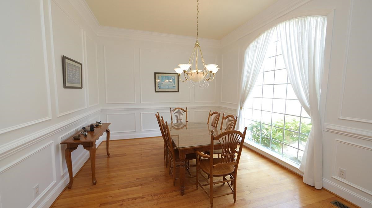 5817 Stone Spring Road Raleigh, NC 27613 - Photo 17 of 28 Soothing Views of the Koi Pond & Garden Entrance yet Convenient to the Kitchen for all your Entertaining needs. Dining Room