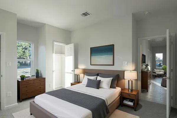 a bedroom with a bed and a view of bathroom