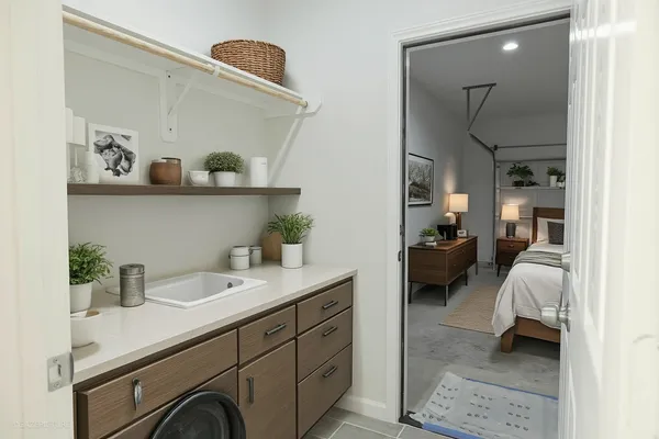 a en suite bathroom with a sink and a mirror