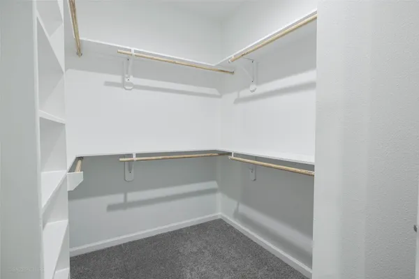 a view of an empty walk in closet