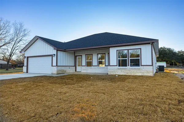 a house that has a large pool in front of it