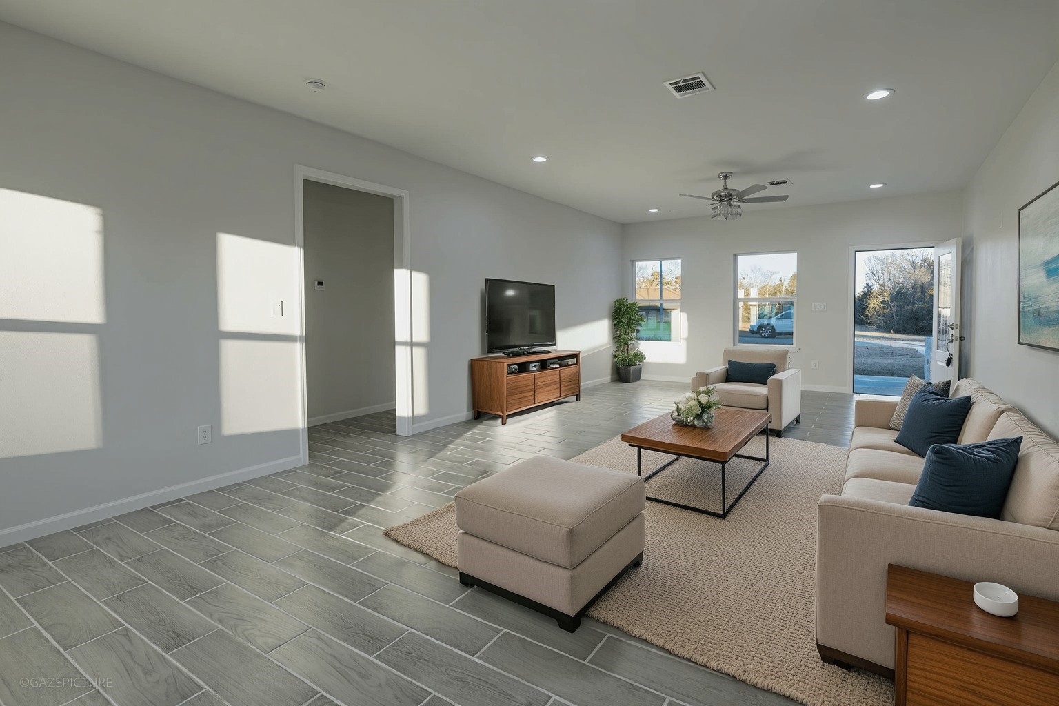 20733 Emerald Street Prairie View, TX 77484 - Photo 6 of 34 a living room with furniture and a flat screen tv