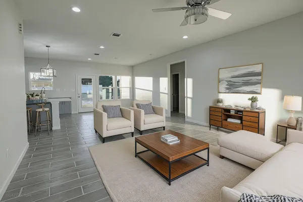 a living room with furniture and a table