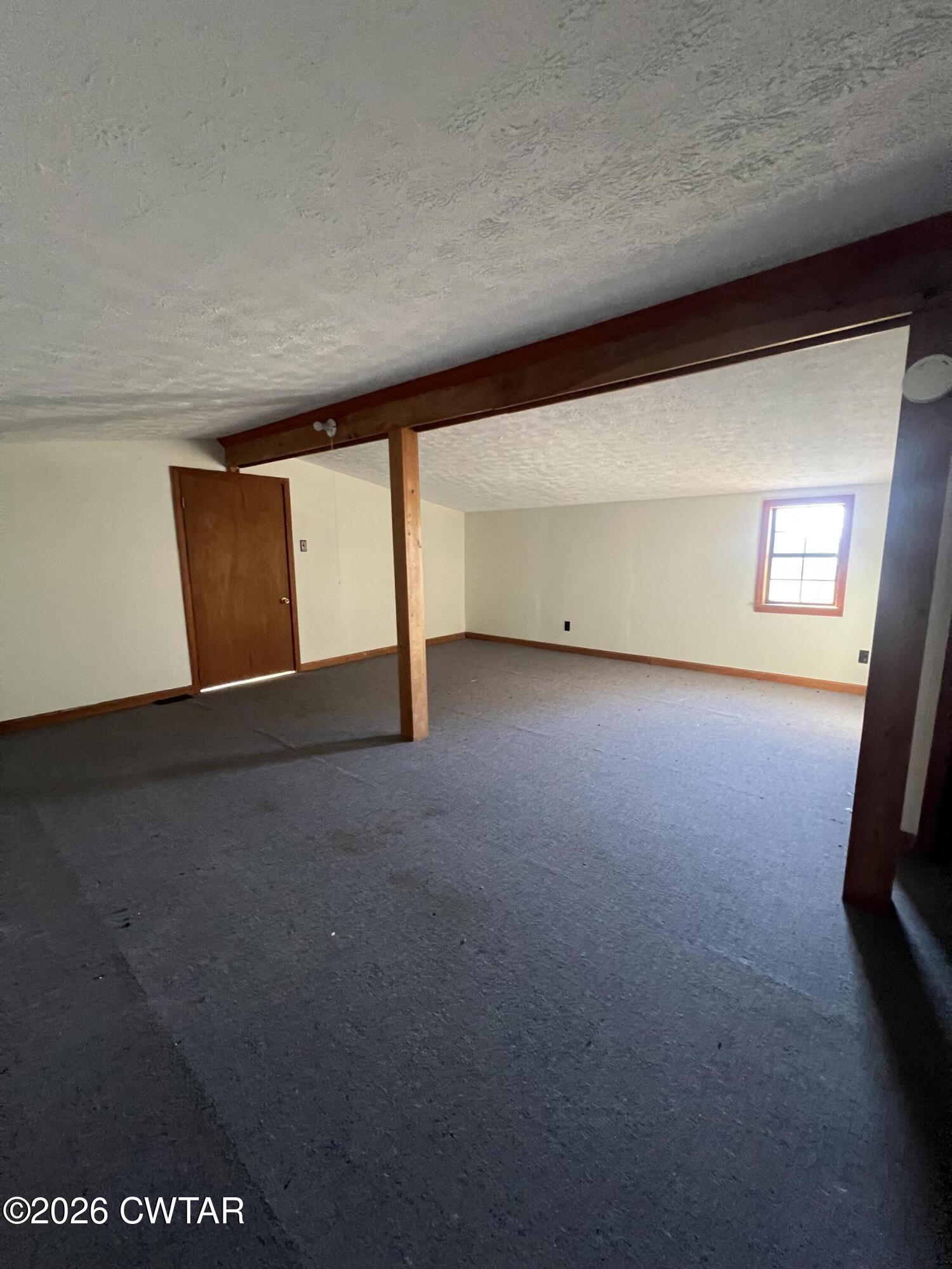 1527 Ashley Road Dyersburg, TN 38024 - Photo 11 of 14 a view of an empty room with a window