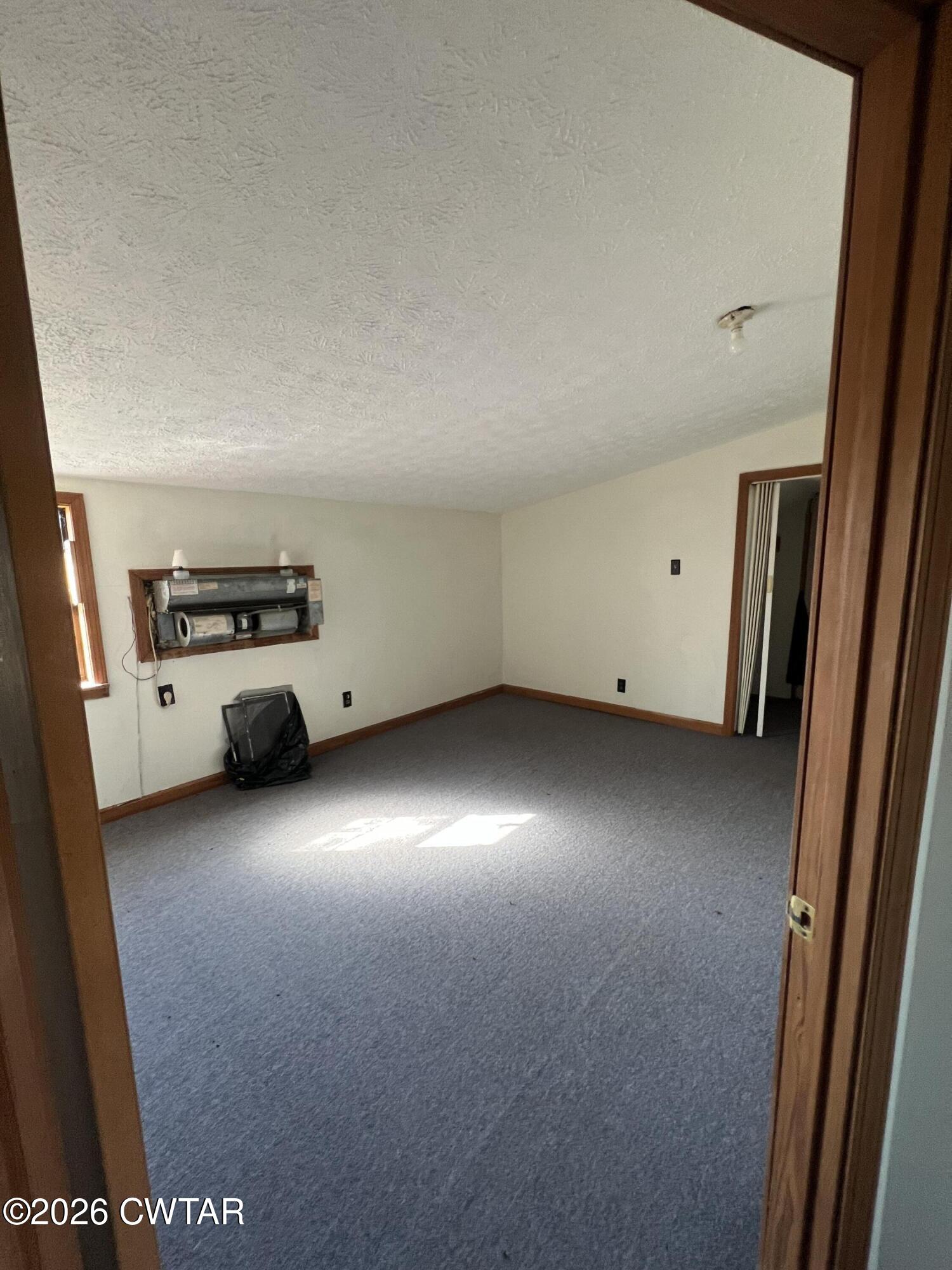 1527 Ashley Road Dyersburg, TN 38024 - Photo 12 of 14 an empty room with windows
