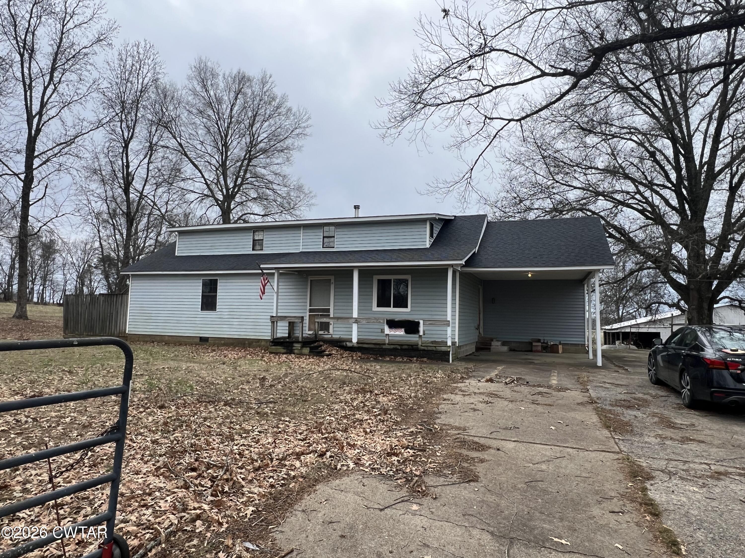1527 Ashley Road Dyersburg, TN 38024 - Photo 3 of 14 a front view of a house with parking space