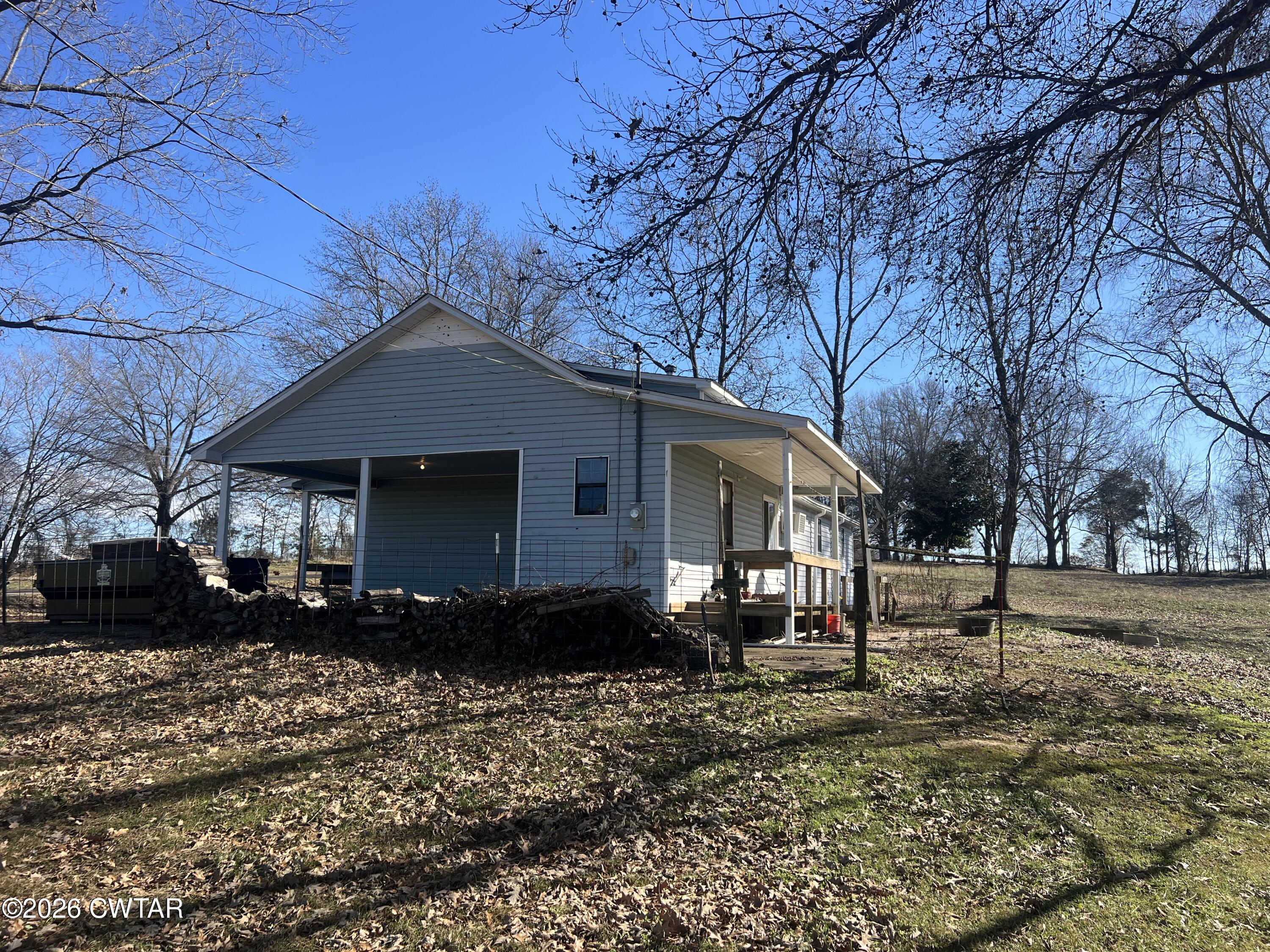 1527 Ashley Road Dyersburg, TN 38024 - Photo 5 of 14 a front view of a house with a yard