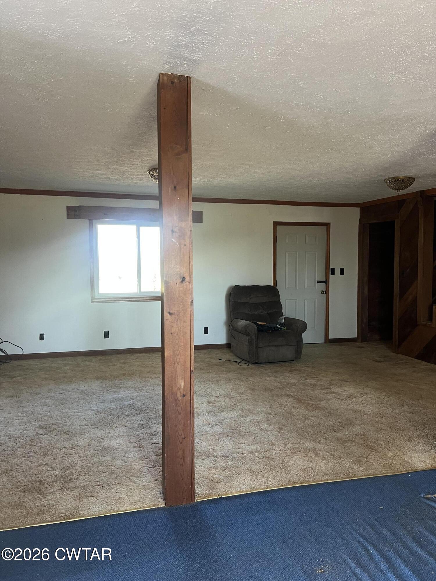 1527 Ashley Road Dyersburg, TN 38024 - Photo 8 of 14 a living room with furniture and a rug