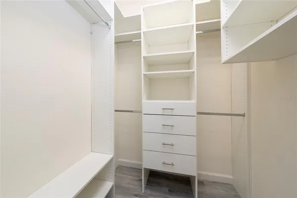 a bathroom with a glass shower door and a mirror