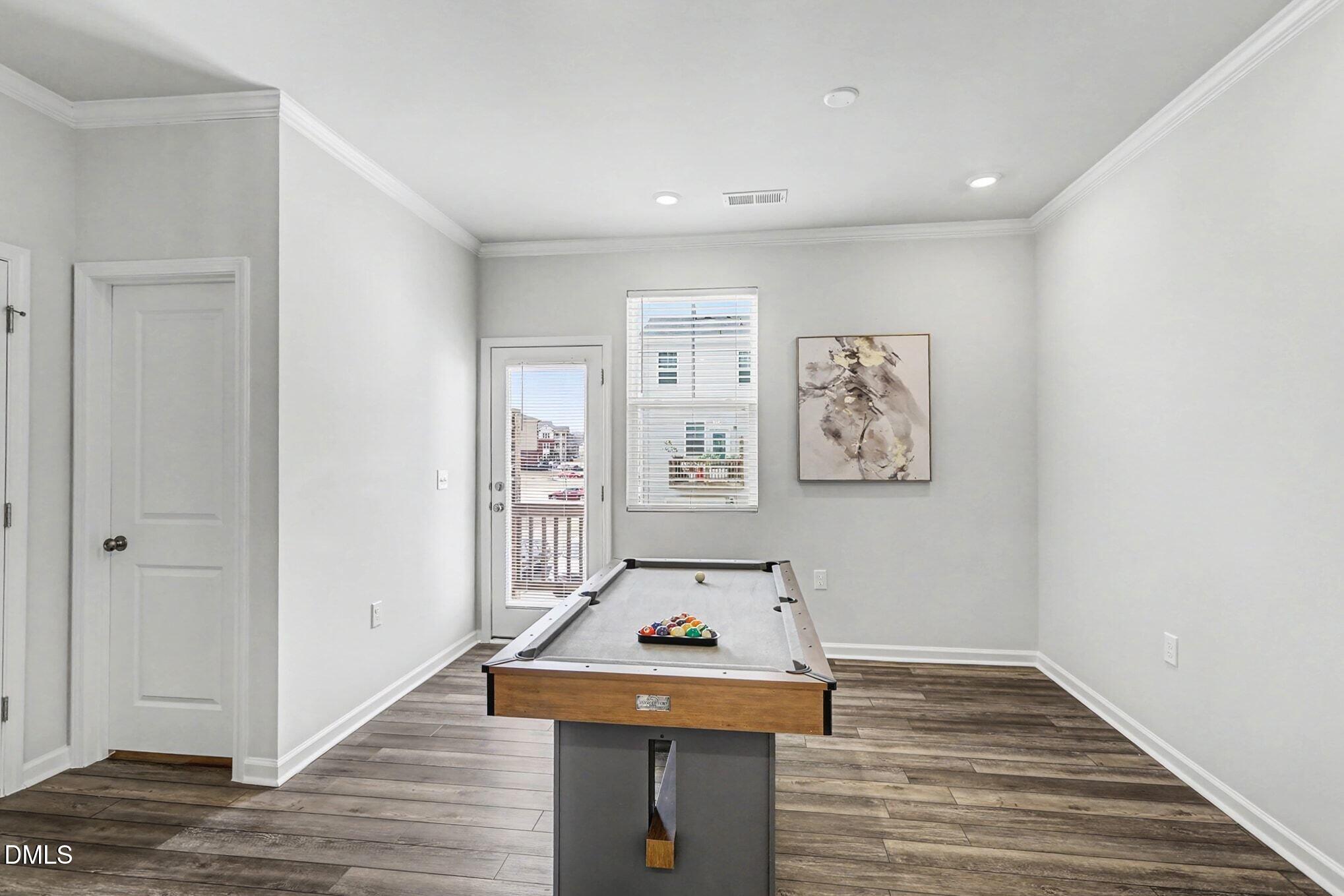 2528 Chert Lane Raleigh, NC 27610 - Photo 7 of 44 a room with painting on the wall and a window