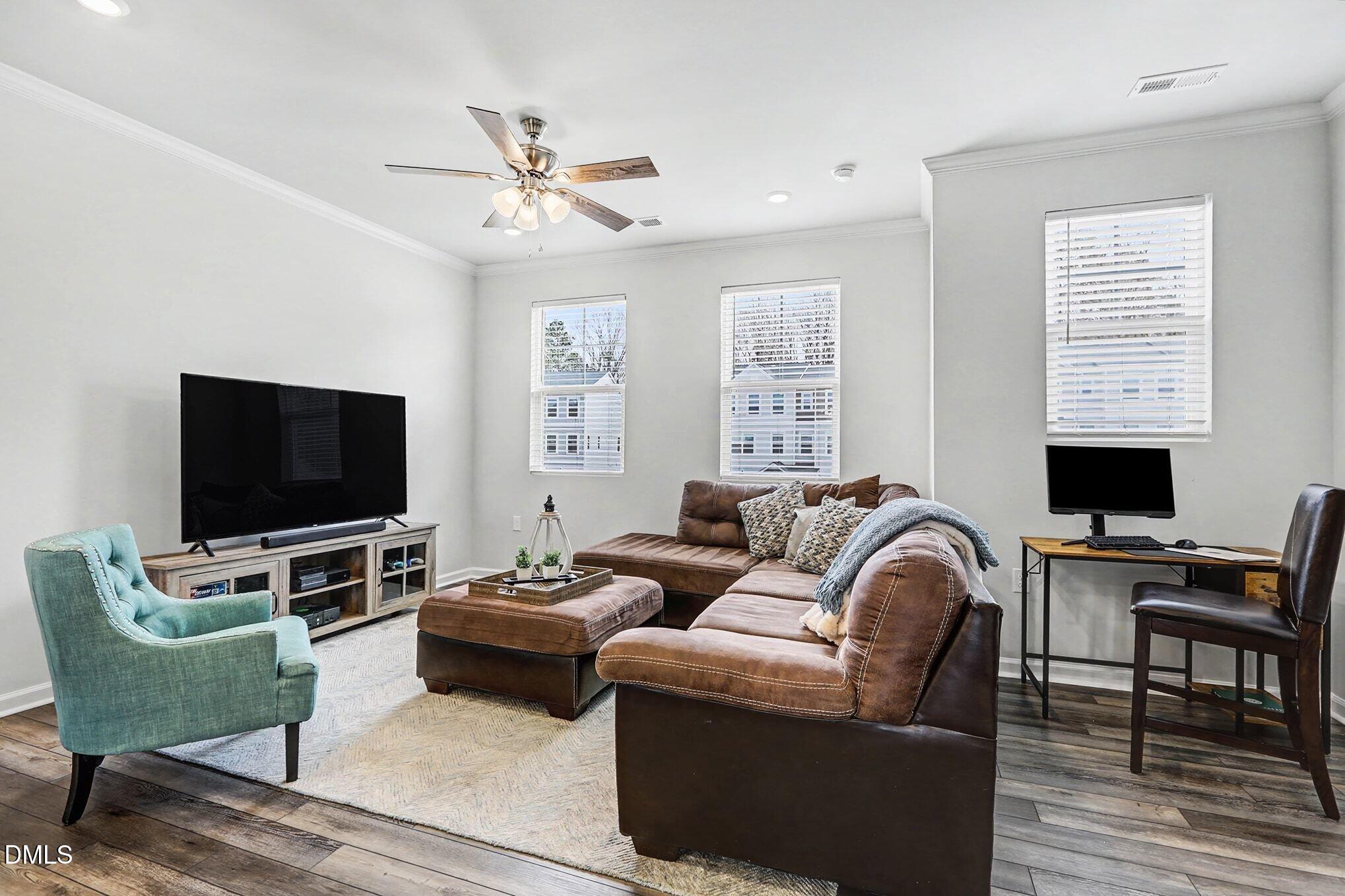 2528 Chert Lane Raleigh, NC 27610 - Photo 10 of 44 a living room with furniture and a flat screen tv